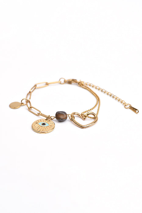 Adjustable gold-plated stainless steel bracelet with tiger's eye, heart charm, and eye charm