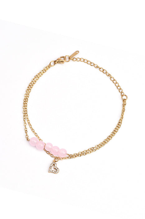 Adjustable gold-plated stainless steel bracelet with pink jade and heart pendant adorned with cubic zirconia