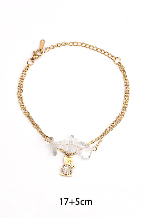Adjustable gold-plated stainless steel bracelet with crystal quartz, lucky cat charm, and zirconia