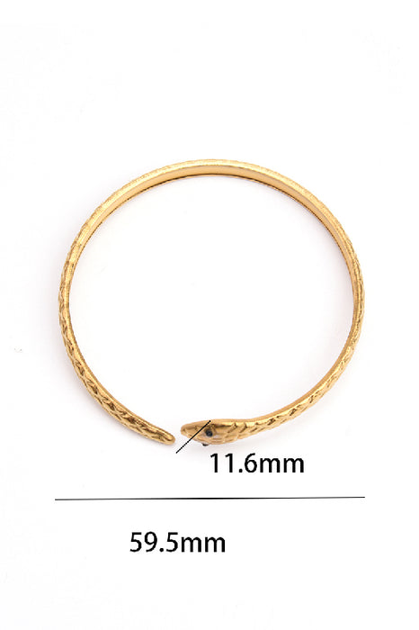 Bracelet jonc ajustable en acier inoxydable plaqué or serpent nervuré œil noir