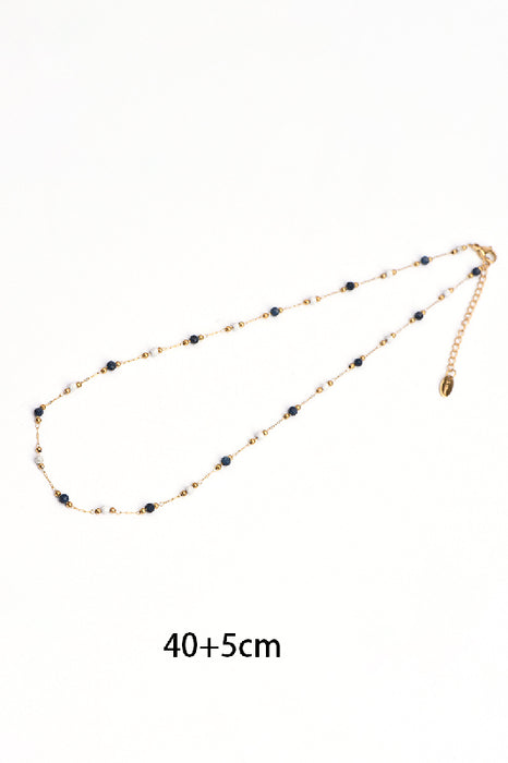 Kette Edelstahl vergoldet 40+5cm facettierter schwarzer Onyx und weisser Howlit