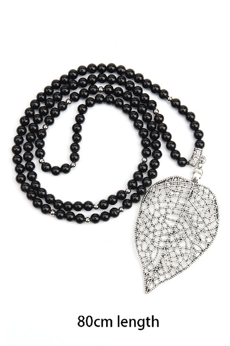 FEHLT_NOCH_Collier de pierres précieuses 80cm - Onyx noir 6mm et pendentif feuille 4.9x8cm