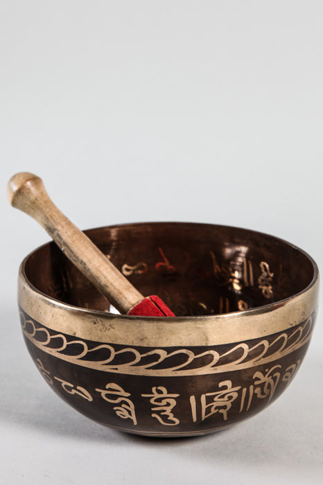 Handmade Tibetan singing bowl with Buddha gold colored 12 - 13 cm