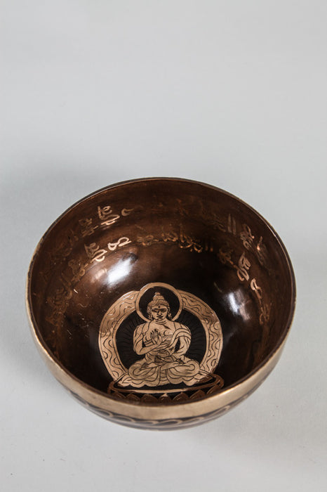 Handmade Tibetan singing bowl with Buddha gold colored 12 - 13 cm