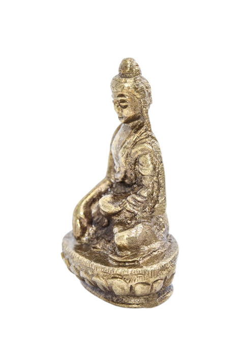 Brass figure of Buddha praying