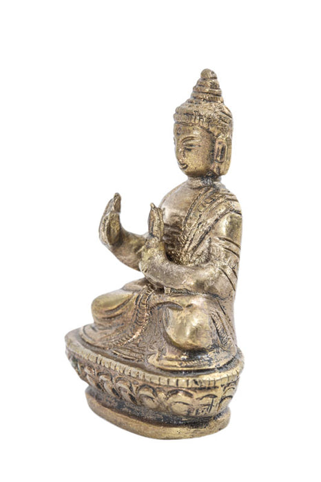 Brass figure of Buddha praying