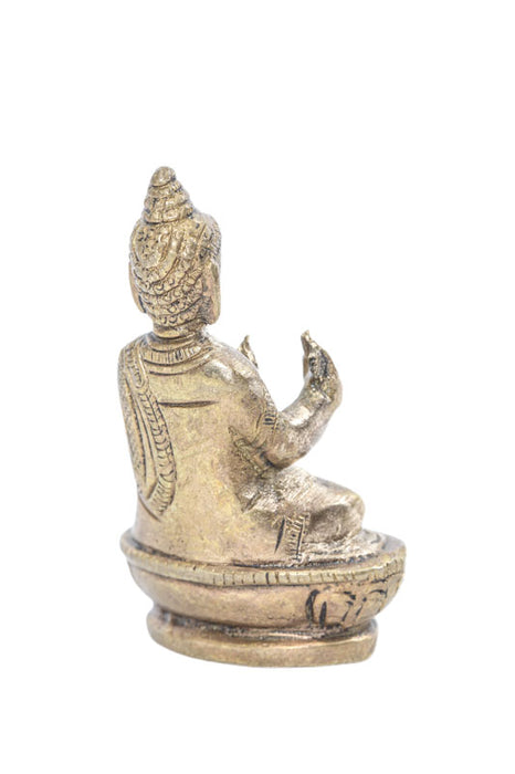 Brass figure of Buddha praying