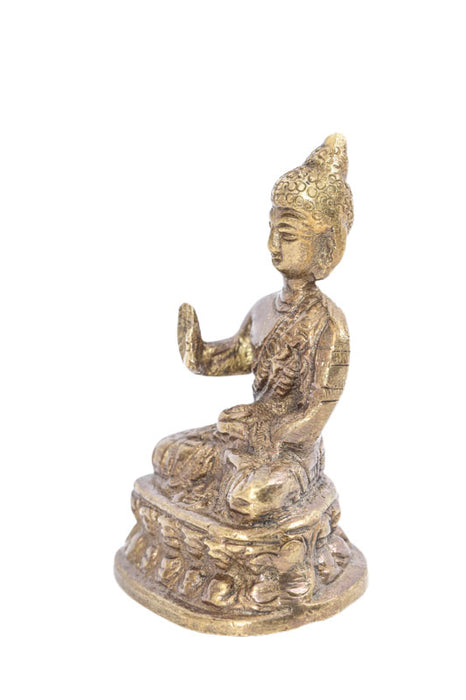 Brass figure of Buddha praying