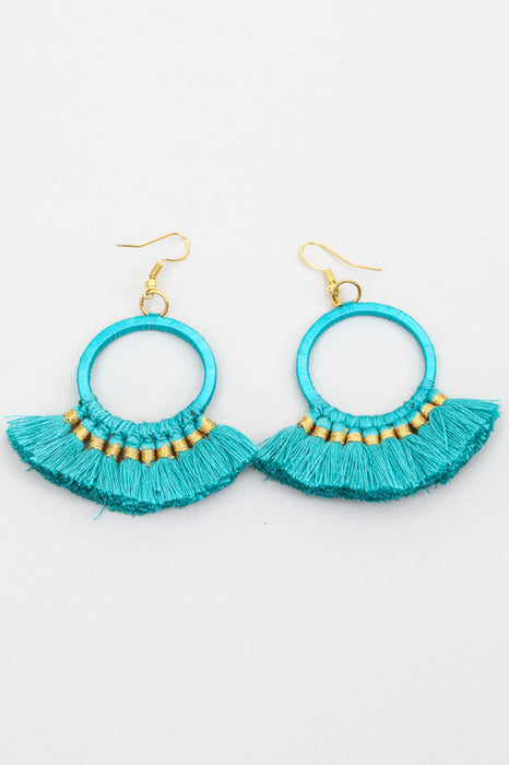 Boucles d'oreilles avec pompon pétrole