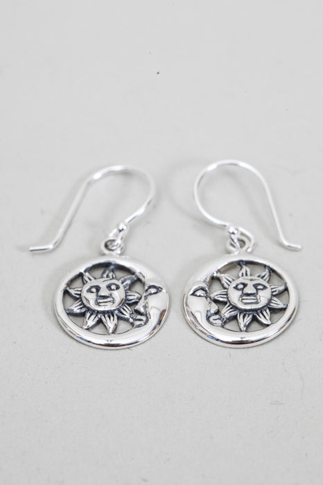 Silver earring laughing sun