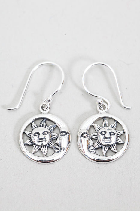 Silver earring laughing sun