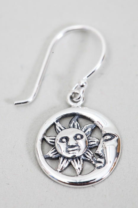 Silver earring laughing sun