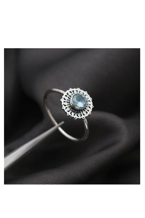 Silver ring blue topaz