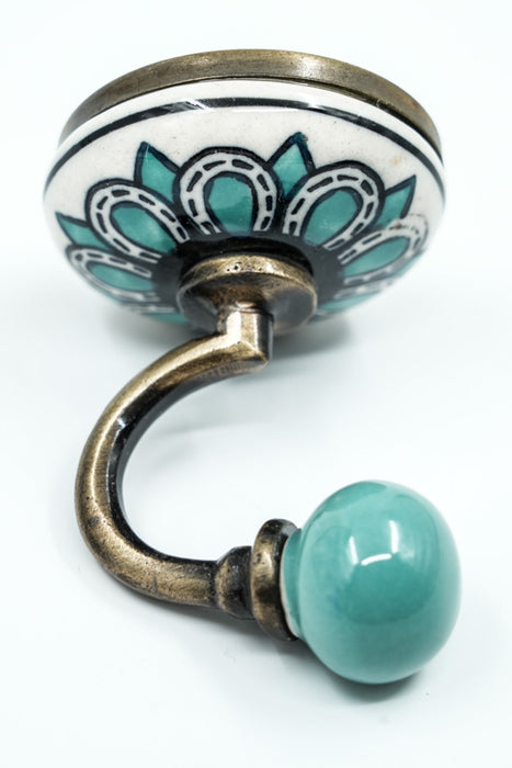 Patère ronde en céramique beige/turquoise/dorée