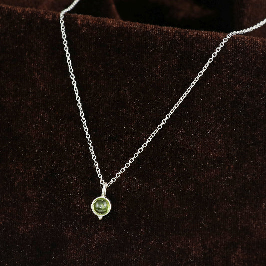Silver necklace with peridot pendant