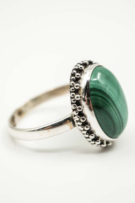 Silver ring with oval malachite decoration
