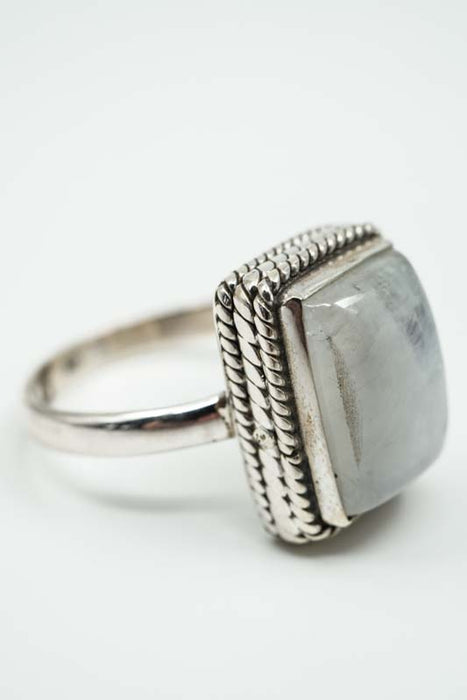 Silver ring rainbow moonstone rectangular ornate setting