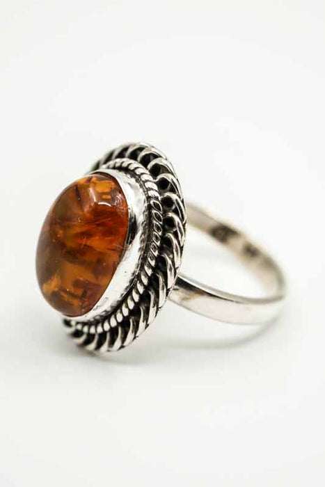 Silver ring Amber oval decorated setting