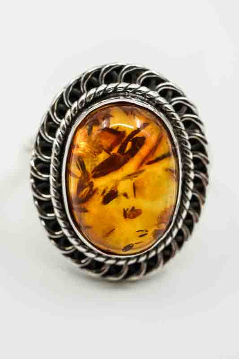 Silver ring Amber oval decorated setting