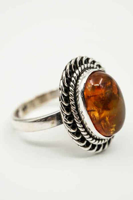 Silver ring Amber oval decorated setting