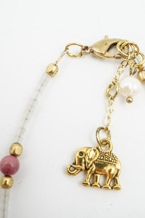 Bracelet, glass beads white/pink with tassel and elephant