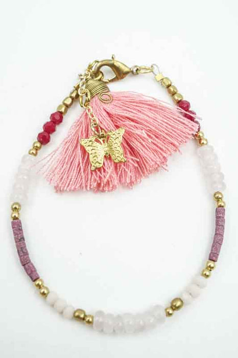 Bracelet perles de verre avec pompon abricot