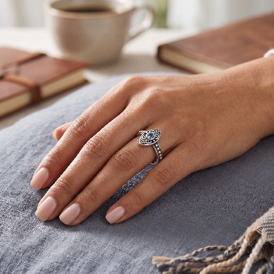 Ring Messing versilbert Fassung Augenförmig mit blauem Topaz