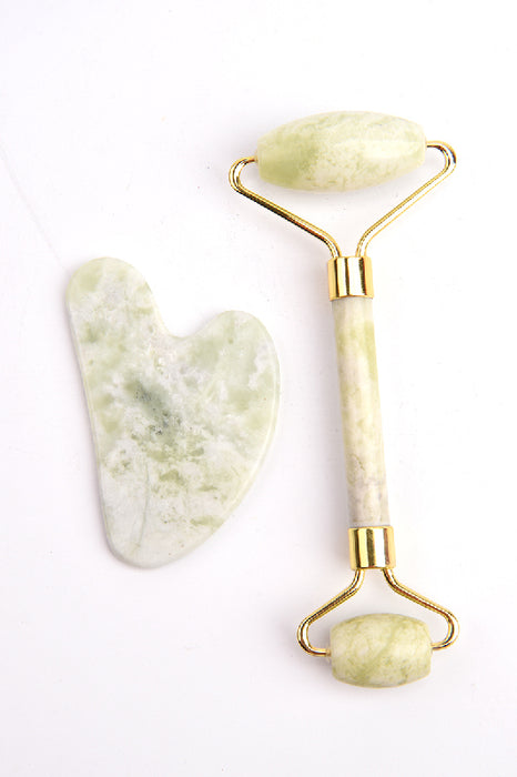 Face roller with heart-shaped light green jade Gua Sha stone