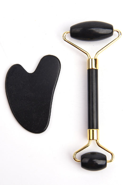 Facial roller with heart-shaped black obsidian Gua Sha stone