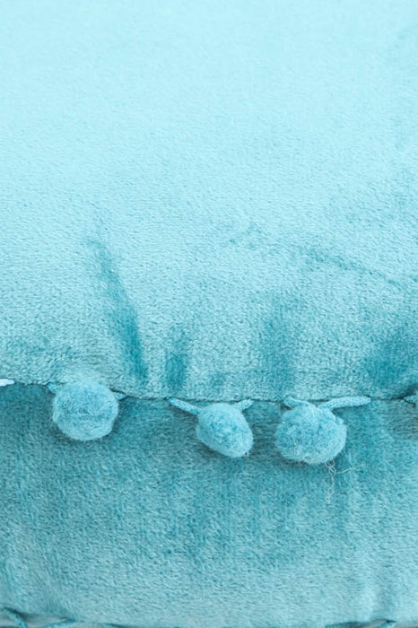 Coussin décoratif rond Pom Pom turquoise